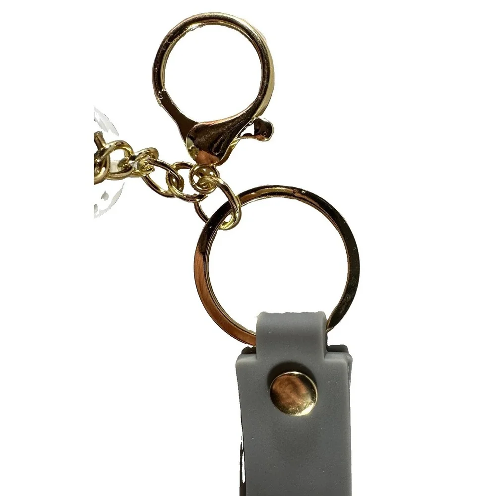Grey & white miniature Nike Keychain styled like an Air Jordan wrist strap/bag